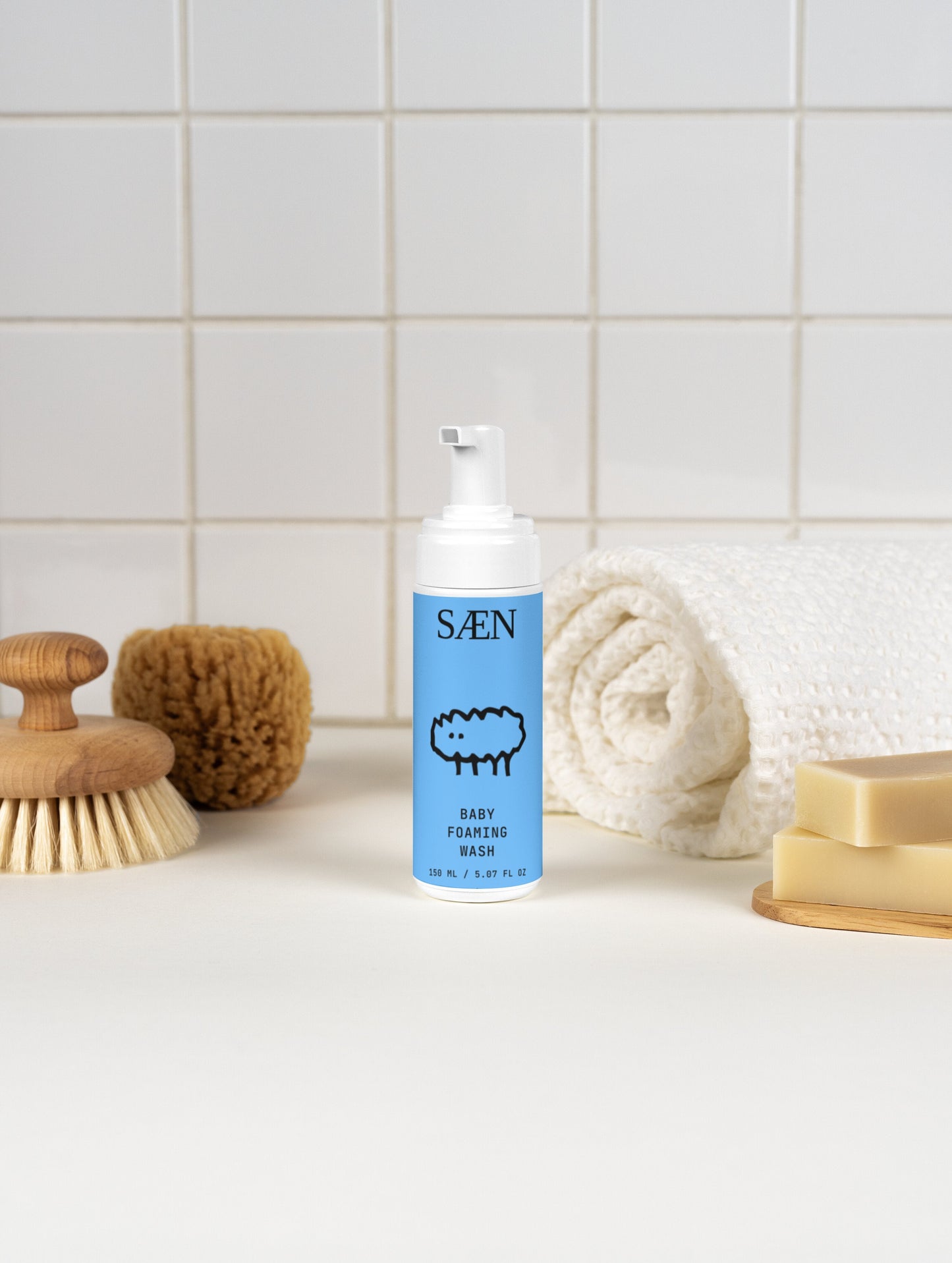 Gentle Baby Foaming Wash by Selfnamed with soft foam in a white bottle, suitable for delicate baby skin.