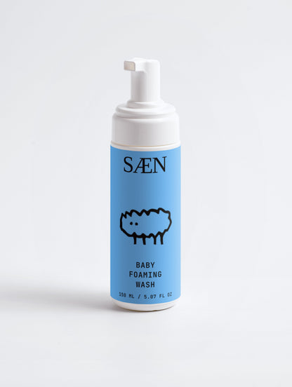 Baby foaming wash by Selfnamed with gentle, foaming cleanser in a clear bottle, suitable for delicate skin and baby skincare routines.