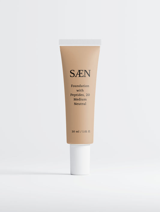Selfnamed Foundation with Peptides in 20 Medium Neutral shade, creamy liquid formula in a sleek bottle.