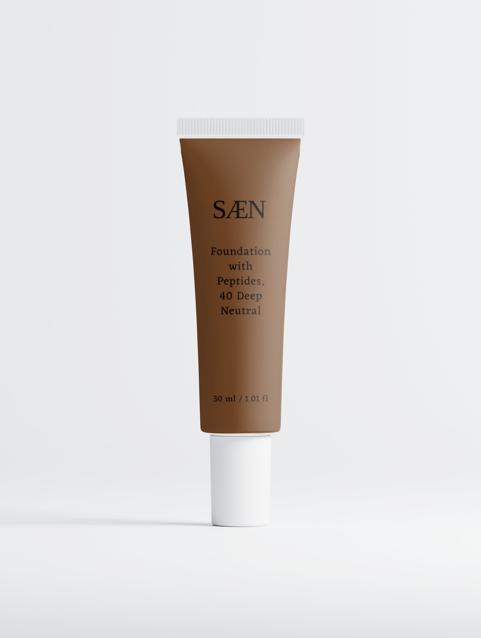 Selfnamed foundation with peptides in 40 Deep Neutral shade, showing a smooth, creamy makeup product in a sleek tube.