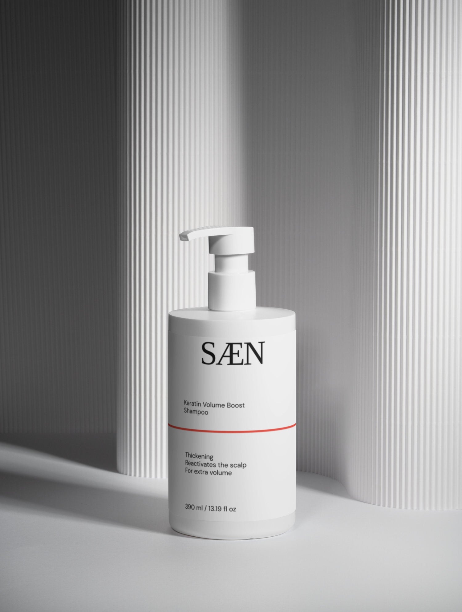 Selfnamed Keratin Volume Boost Shampoo bottle with label, showing thick, voluminous hair and the product's packaging.
