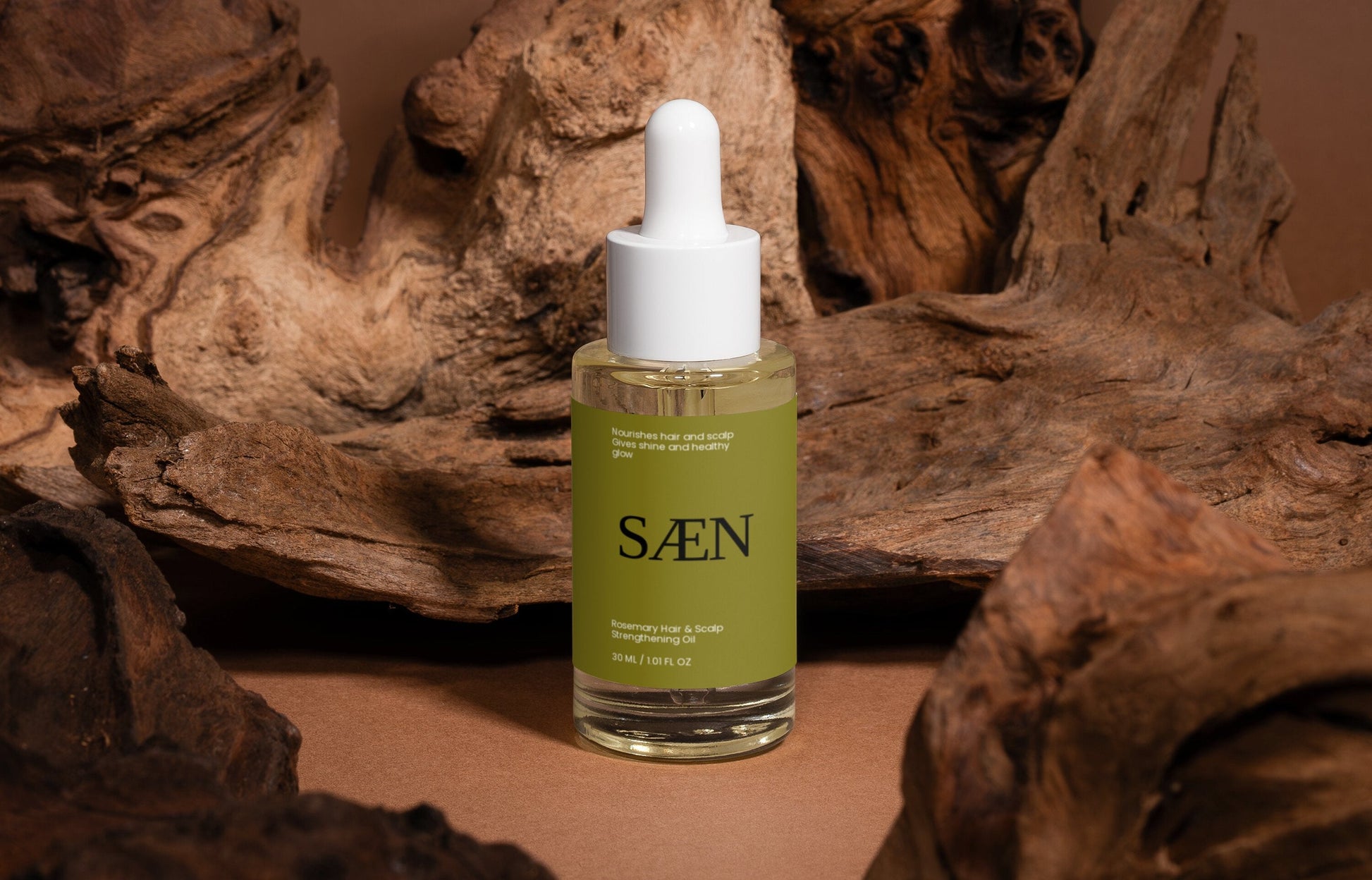 Bottle of Selfnamed Rosemary Hair and Scalp Strengthening Oil showing the product label and natural rosemary ingredients